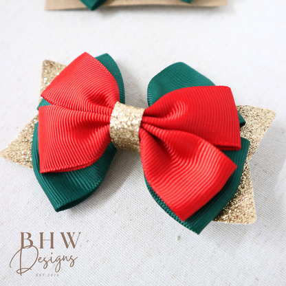 Red and green hair bows with gold accents 