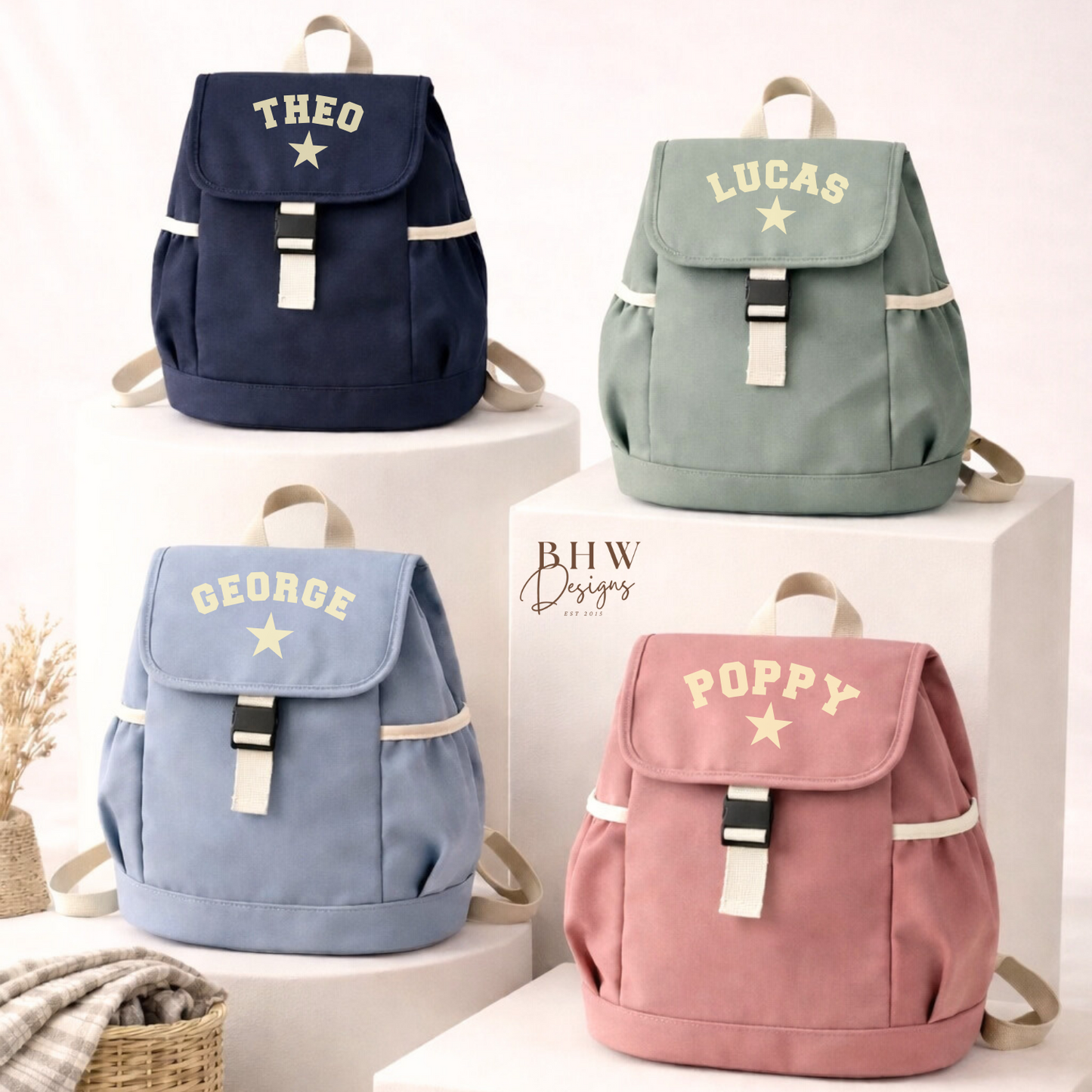 Four backpacks with names printed on them, displayed on white boxes.