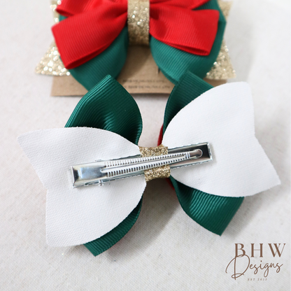 two coulorful hair bows with a clip 