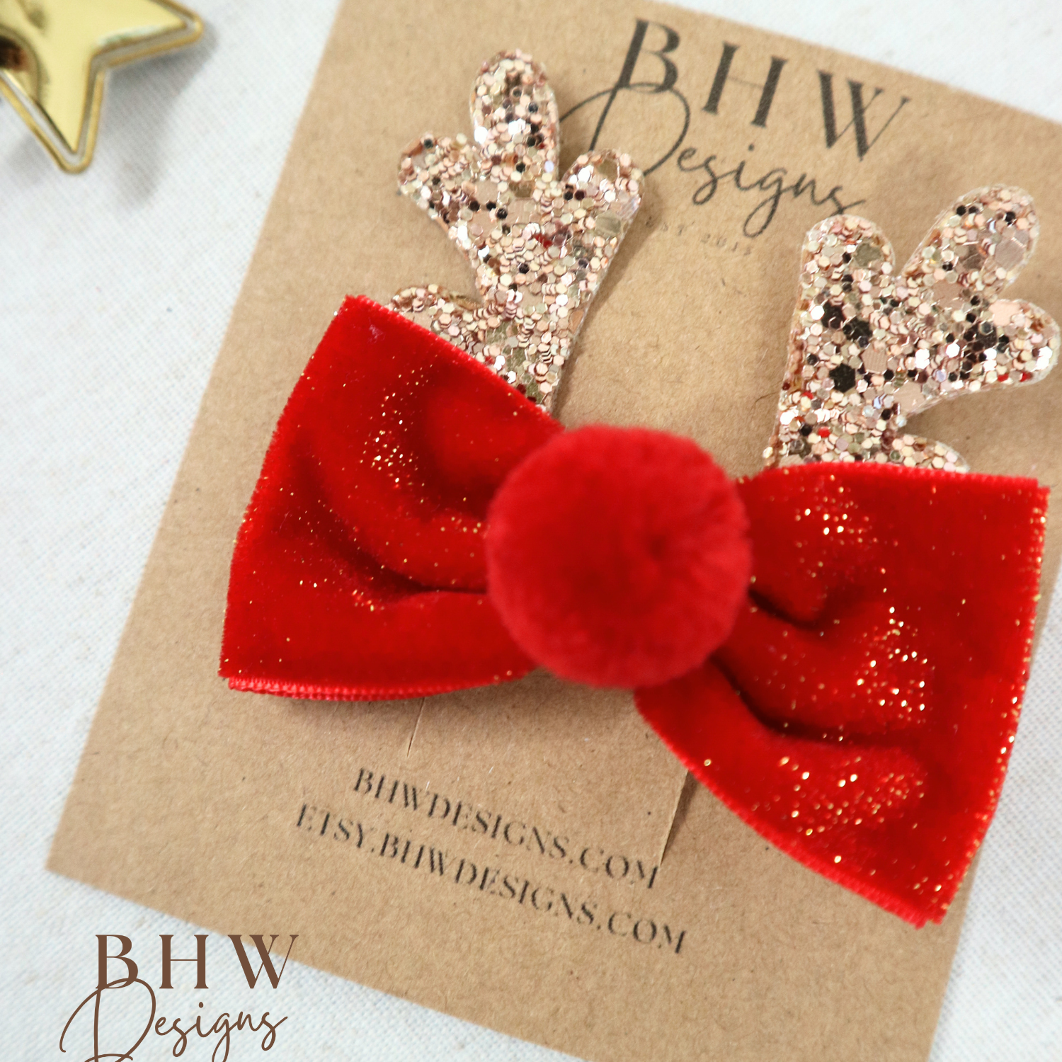 Red glittery bow with gold antlers