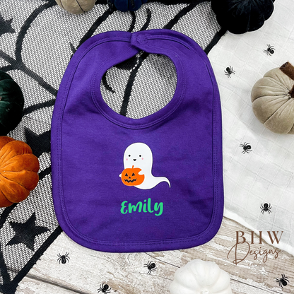 personalised Purple bib with ghost design and 'Emily' text on a Halloween-themed background