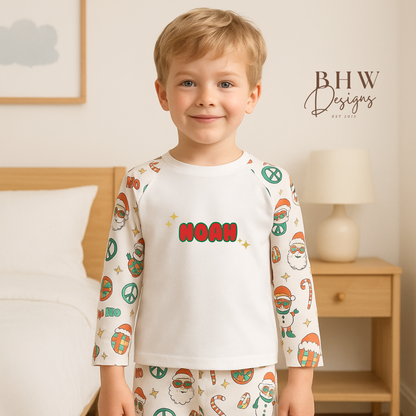 Child wearing a pajama set with 'NORAH' printed on it, standing in a bedroom.