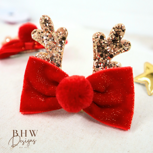 Red velvet bow with gold glitter antlers on 