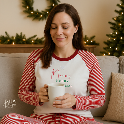 Woman wearing red and white striped pyjamas personalised on the front with a silver glitter star and a name in red and merry Christmas in green, sitting on a couch