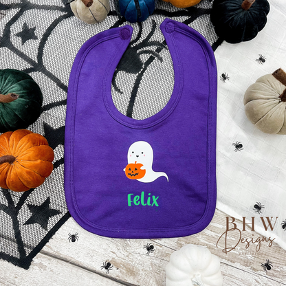 Personalised Purple bib with ghost and pumpkin design on a Halloween-themed background