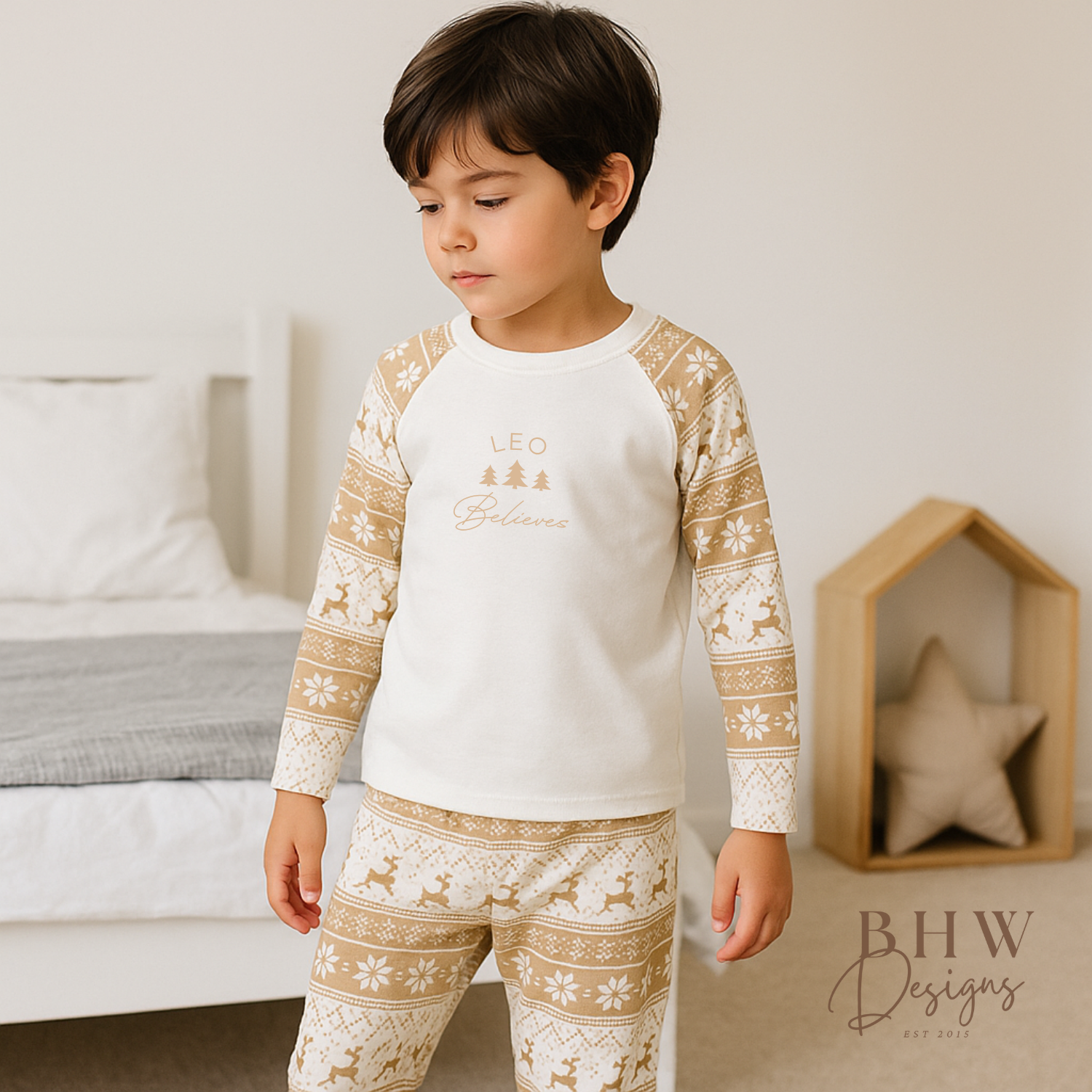 Child wearing a pair of beige and white fair isle print pyjama set 