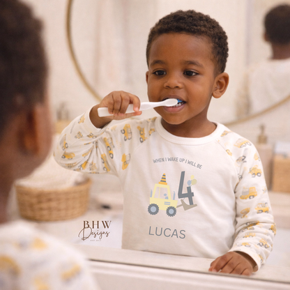Child brushing teeth with a personalised digger design pyjamas 
