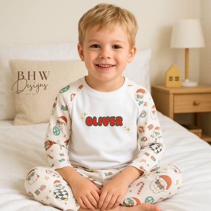 Child wearing pajamas with 'Oliver' printed on a bed, featuring BHW Designs branding.