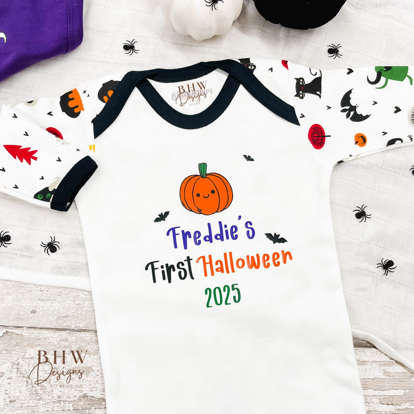 Halloween-themed baby outfit with pumpkin design and personalised First Halloween 2025