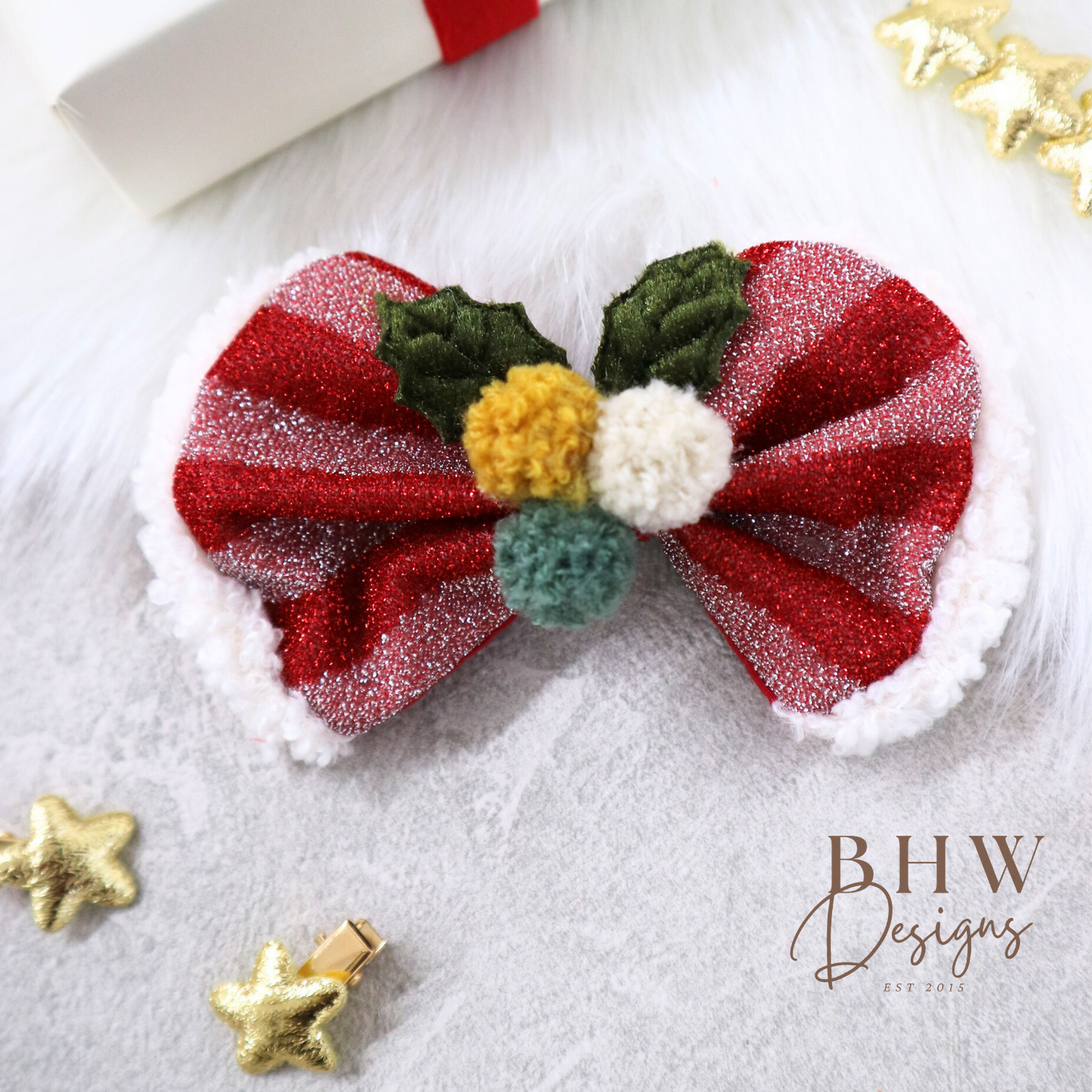 Decorative bow with red, green, and white coulors on a textured surface 
