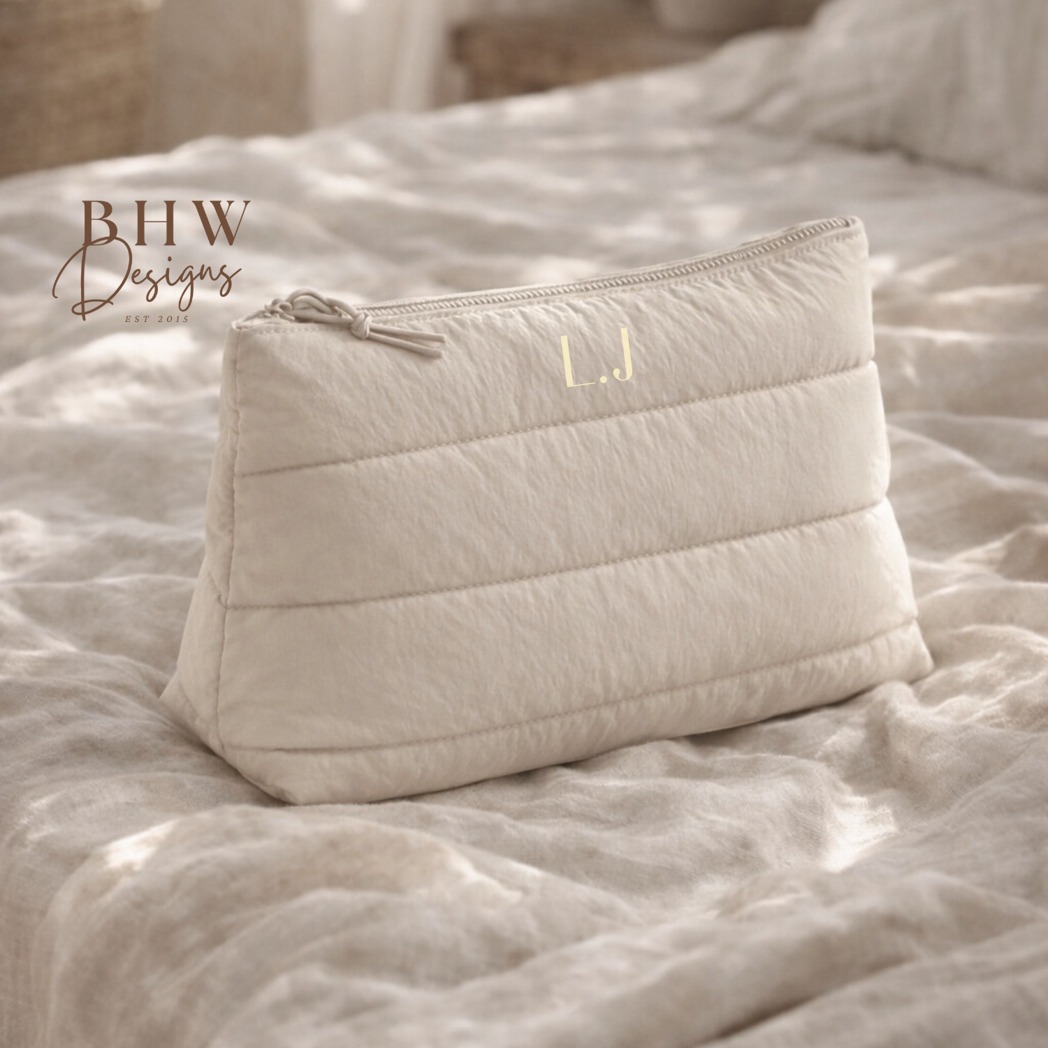 beige quilted pouch on a textured surface