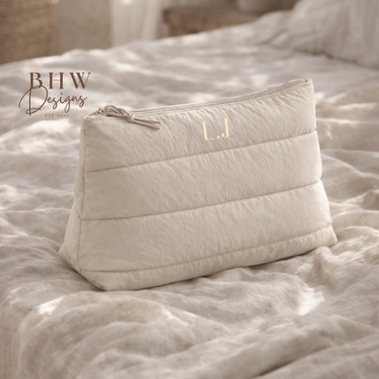 beige quilted pouch on a textured surface