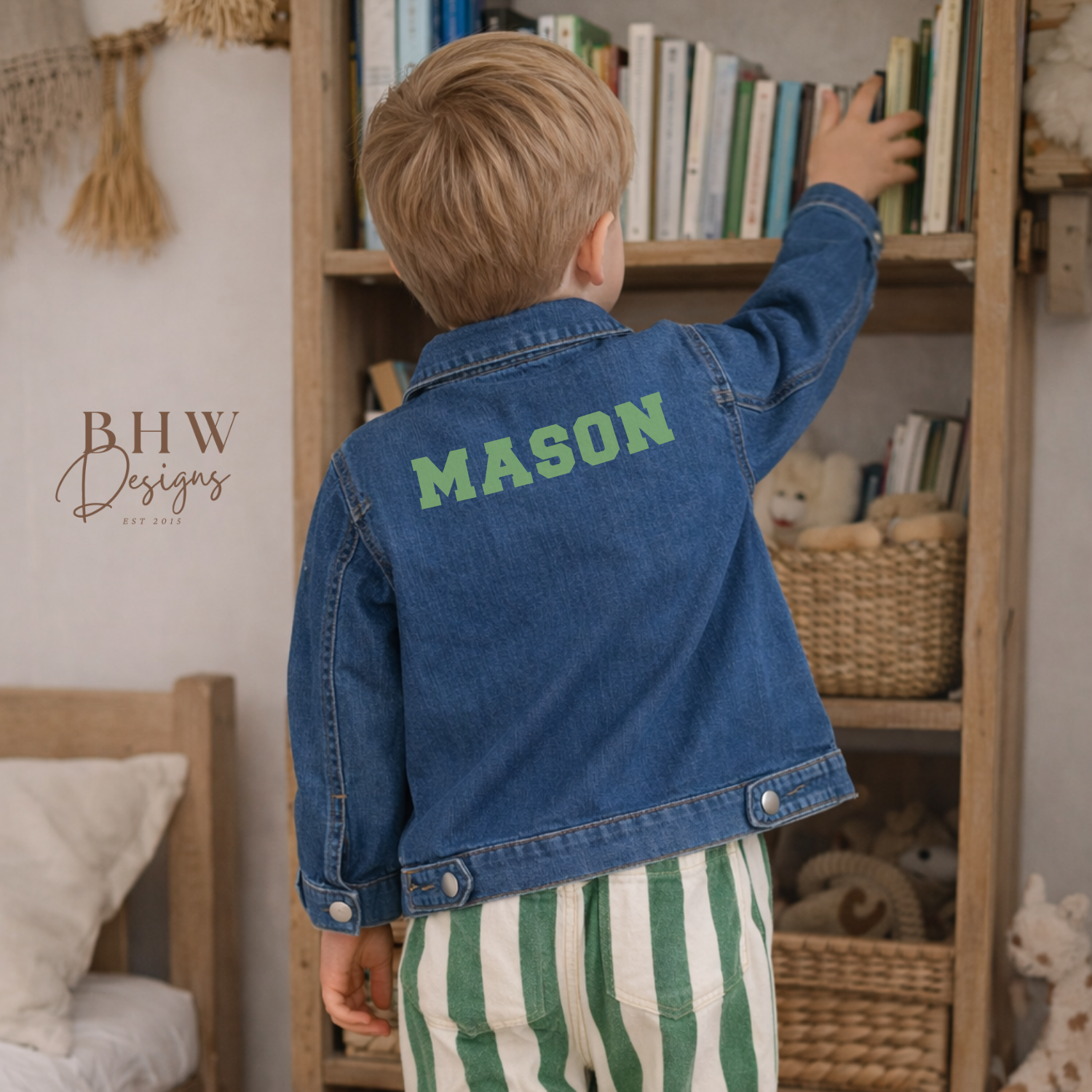 Child wearing a blue denim jacket with 'MASON' on the back in sage green