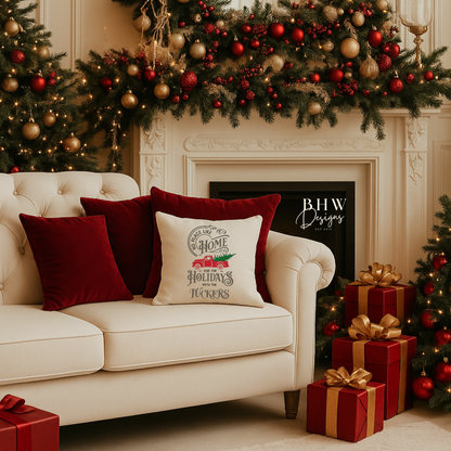 Decorated living room with Christmas trees, presents, and a couch with festive cushions and a no place like home personalised cushion