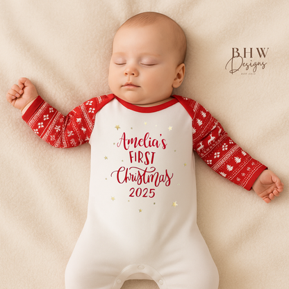 Baby wearing a 'Amelia's First Christmas 2025' onesie in a red and white fair isle print