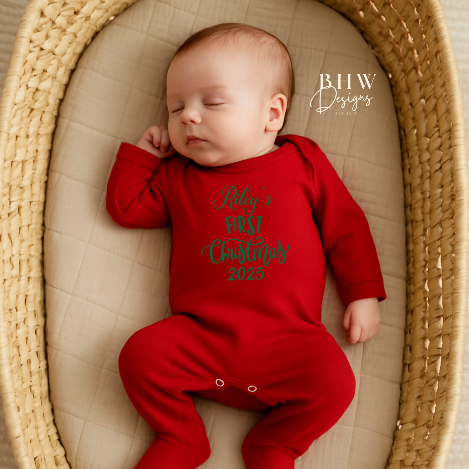 Baby in a red onesie with text, Rileys First Christmas 2025 on the front in Green