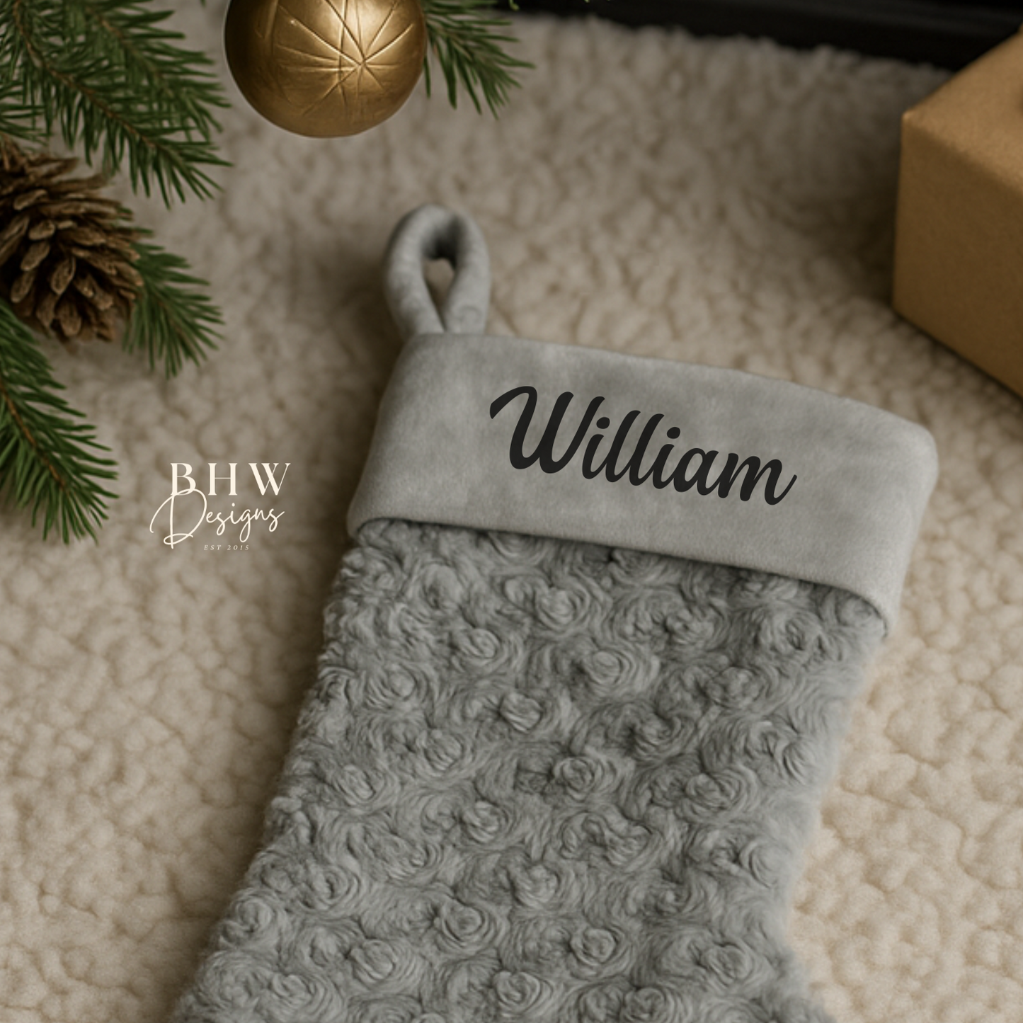 Grey textured Christmas stocking with personalised name 'William' on it.