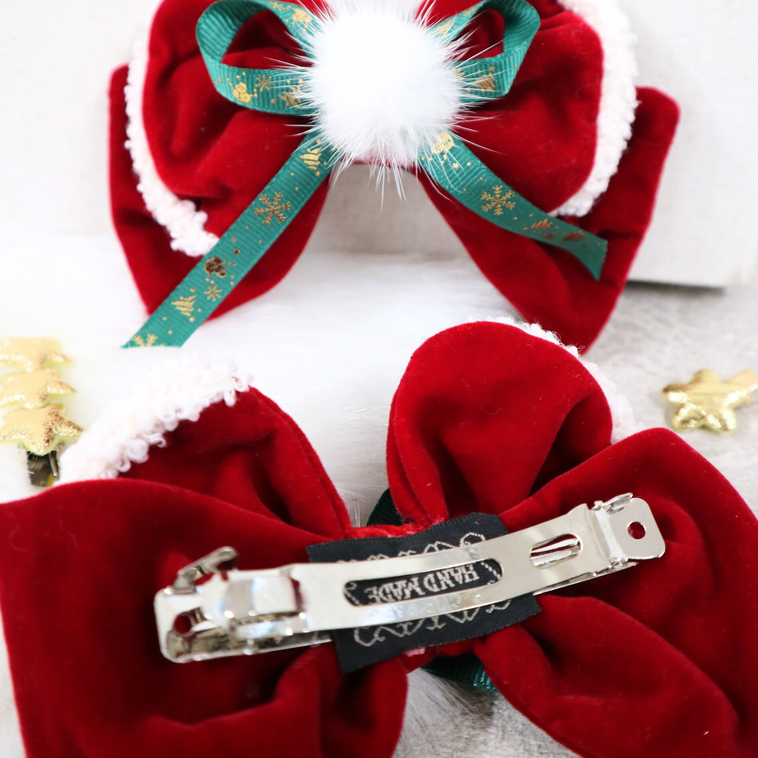 Red velvet hair bows with green ribbons and white pom pom 