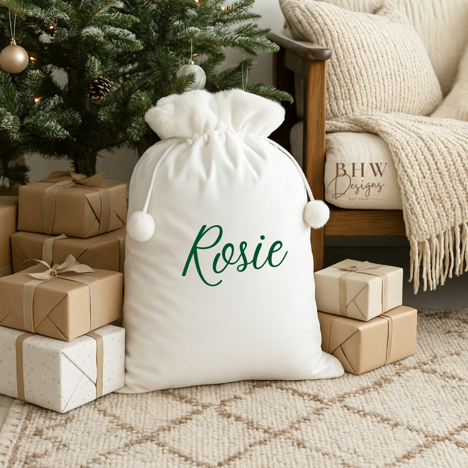 White drawstring santa sack white faux fur trim and pom pom with 'Rosie' written on it in green 