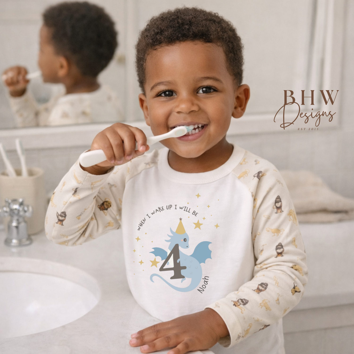 Child brushing teeth with a toothbrush, wearing a shirt with a dragon design and number 4, in a bathroom setting.