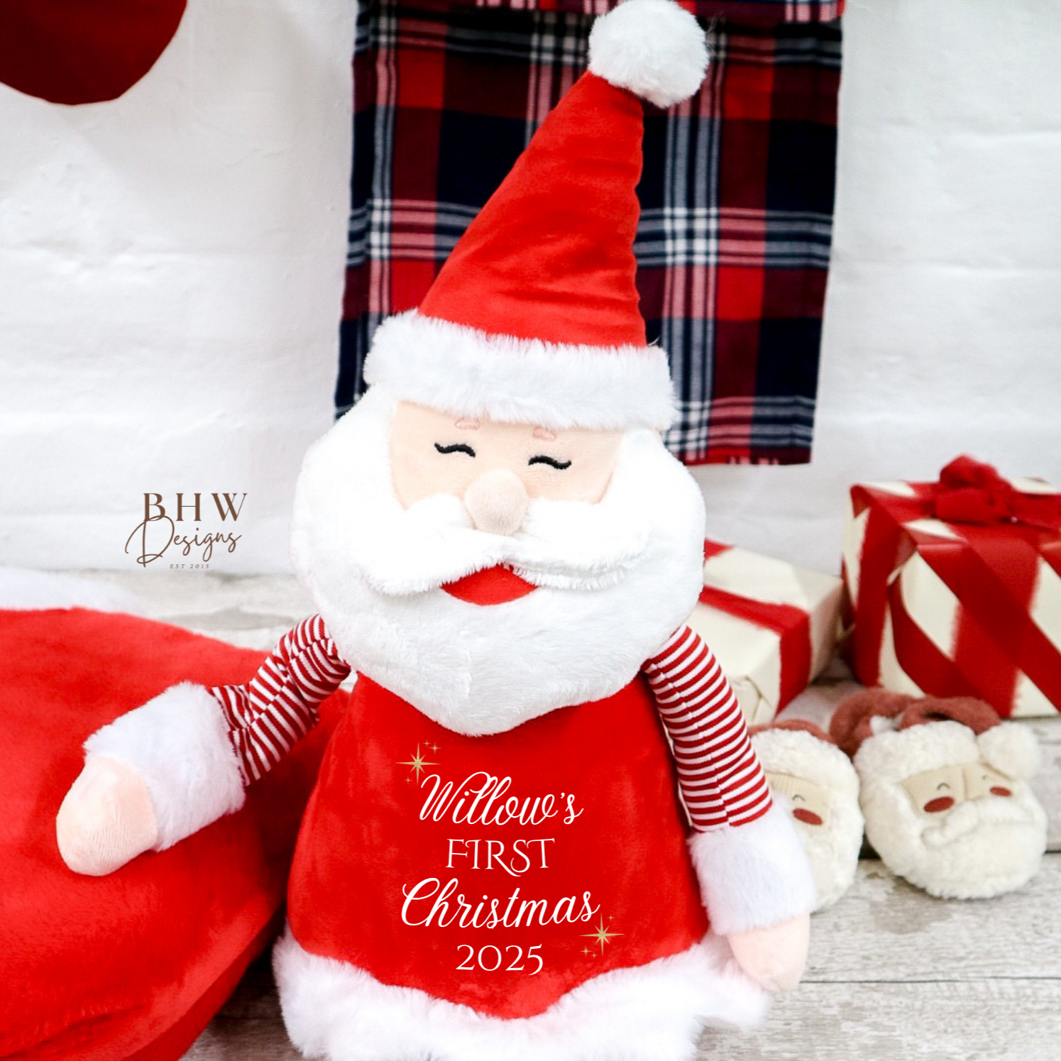 Plush Santa Claus toy with 'Willow's First Christmas 2025' text, 