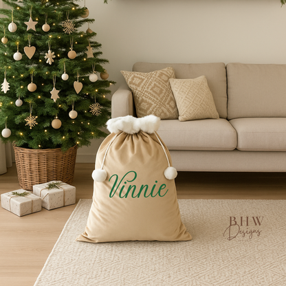 Decorated Christmas tree in a living room with a personalised beige velvet Santa sack 