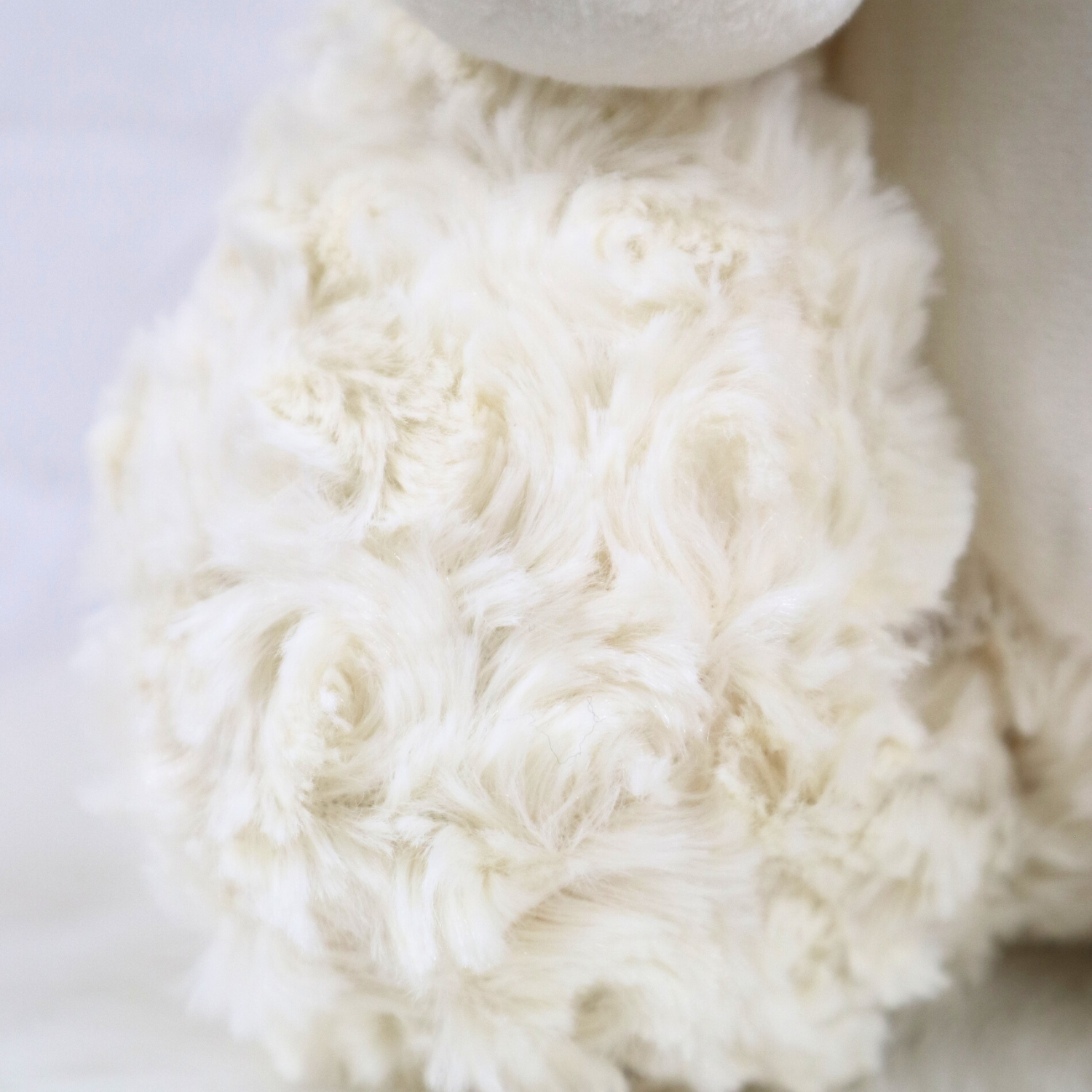 Close-up of a fluffy cream teddy bear