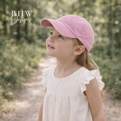 Young girl wearing a pink cap