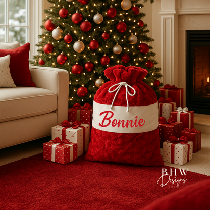 Red and white Santa sack  with 'Bonnie' written on it in red