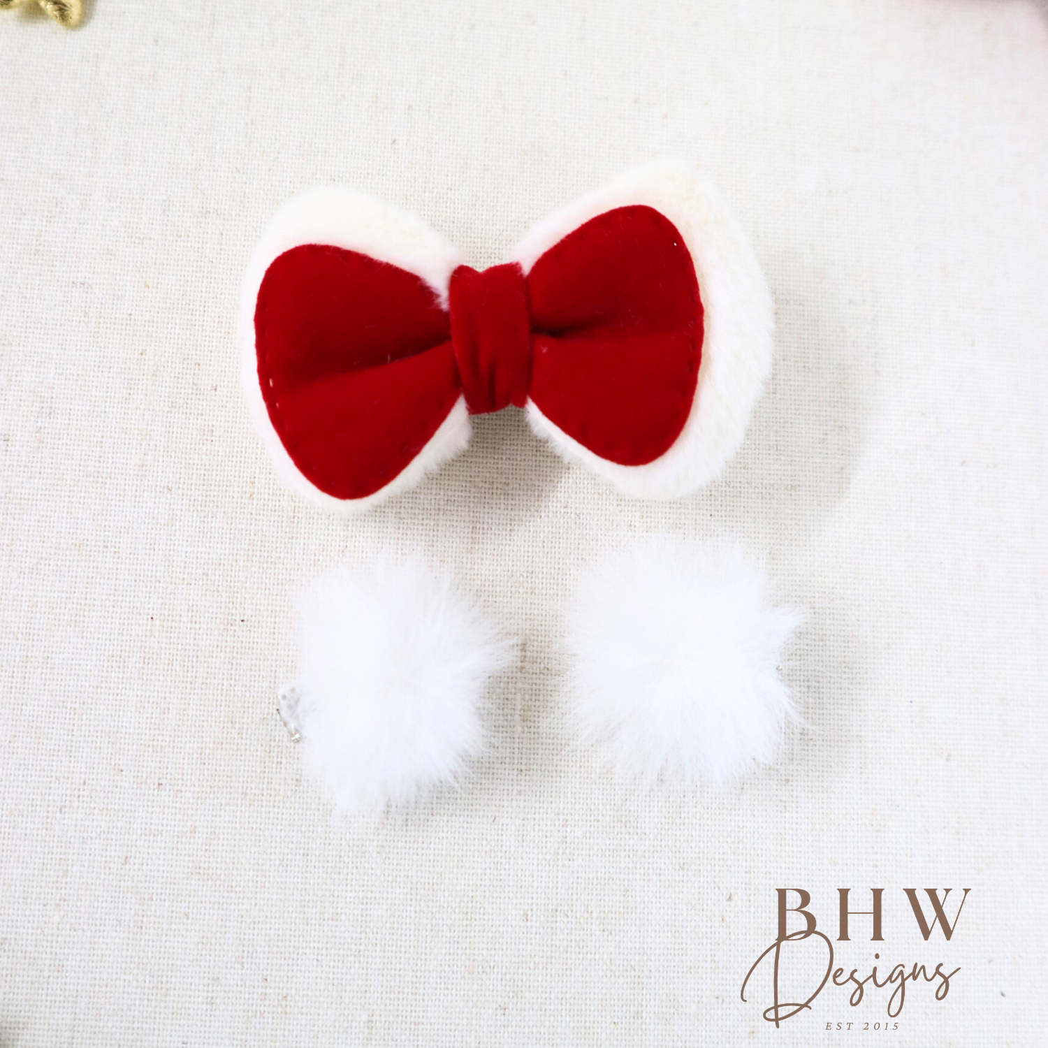 Red bow with white fur on a textured white background, featuring the brand 'BHW Designs'.