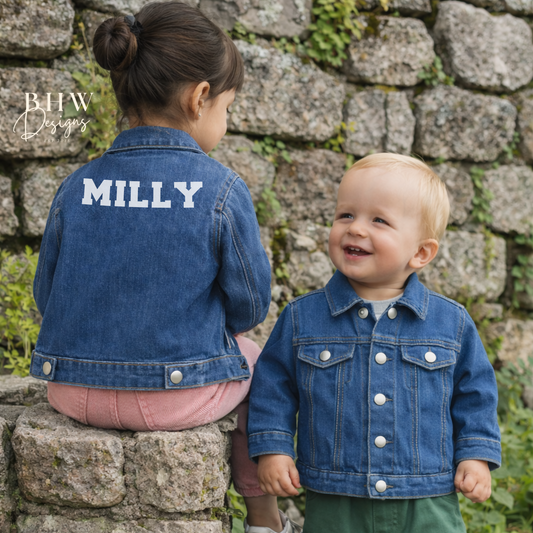 Two children wearing denim jackets with 'MILLY' on the back