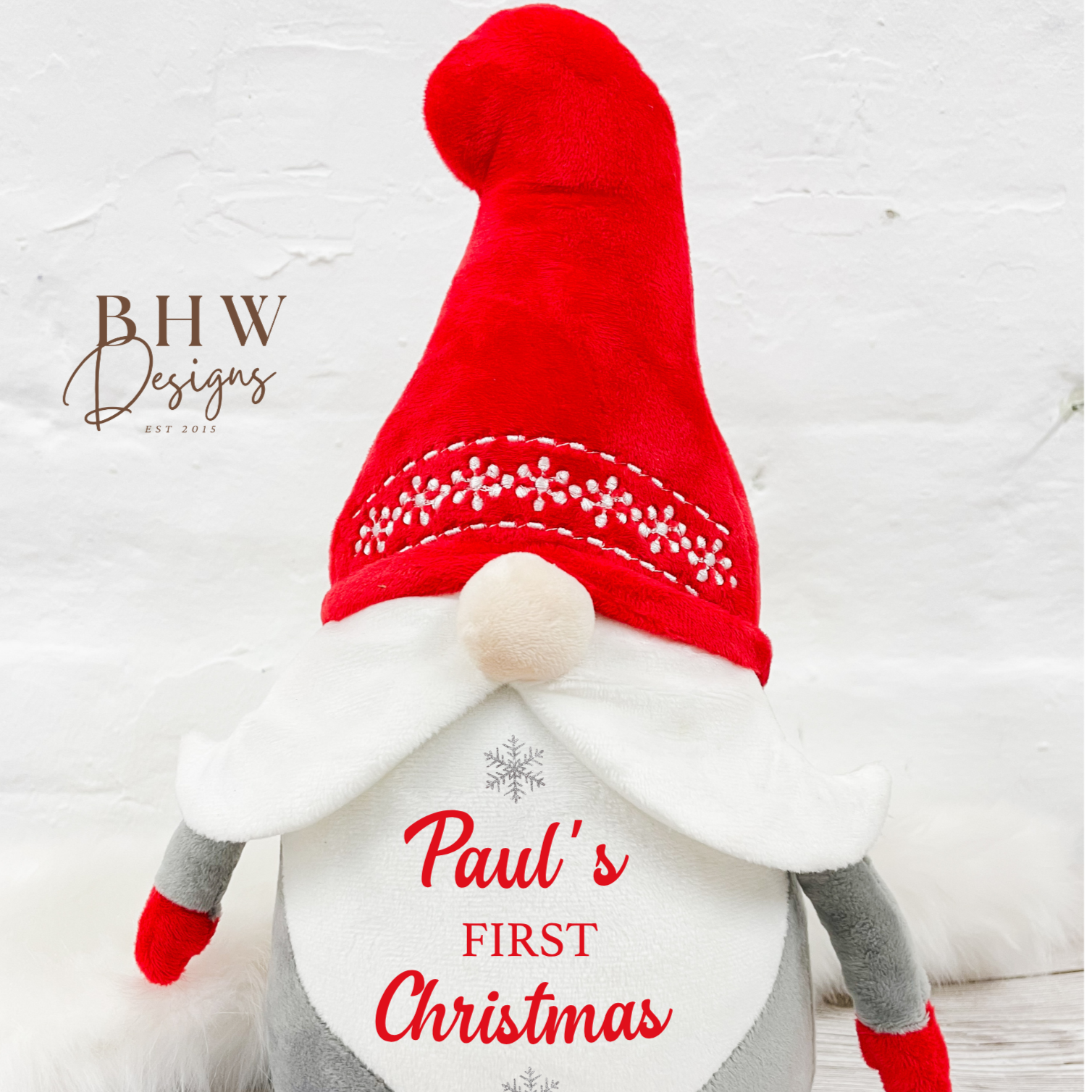 Christmas gnome plush toy with 'Paul's First Christmas 2025' text the front. 