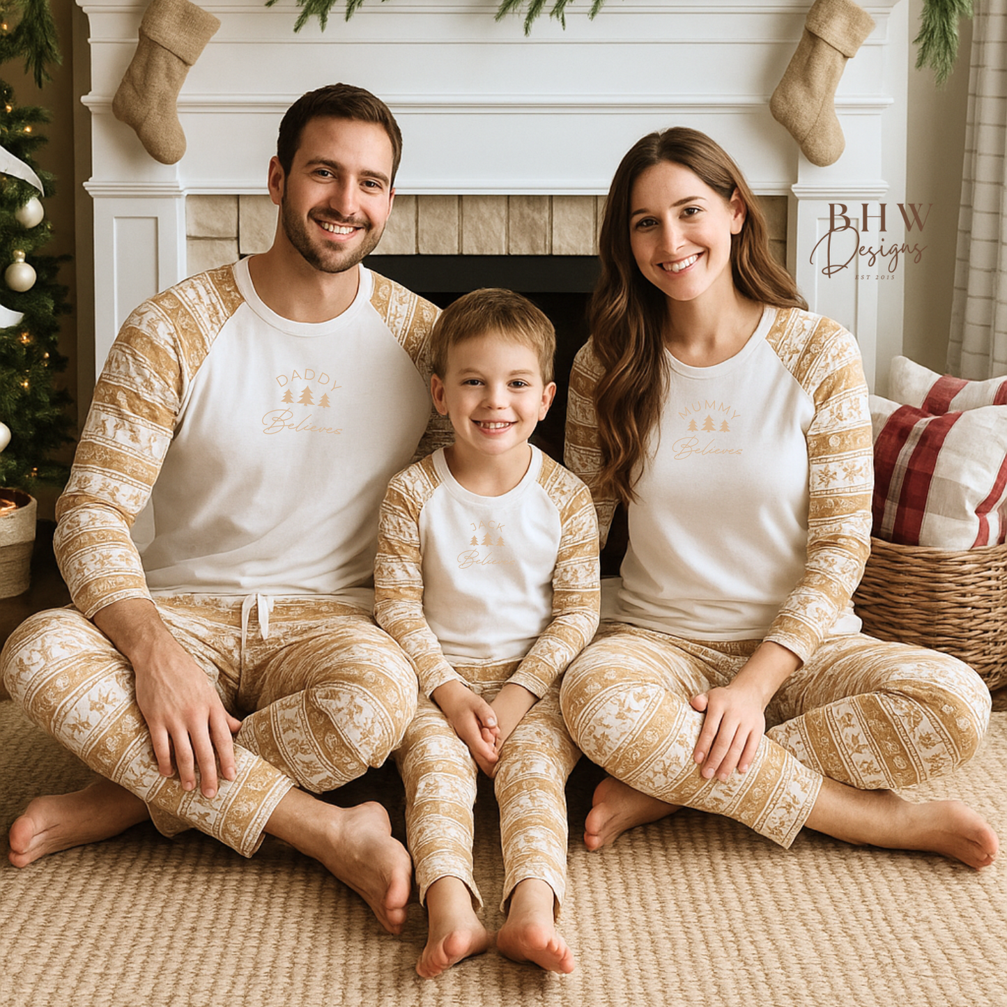 Family wearing a white and beige pyjama set personalised with name and 'Believe' text, on the front in beige. 