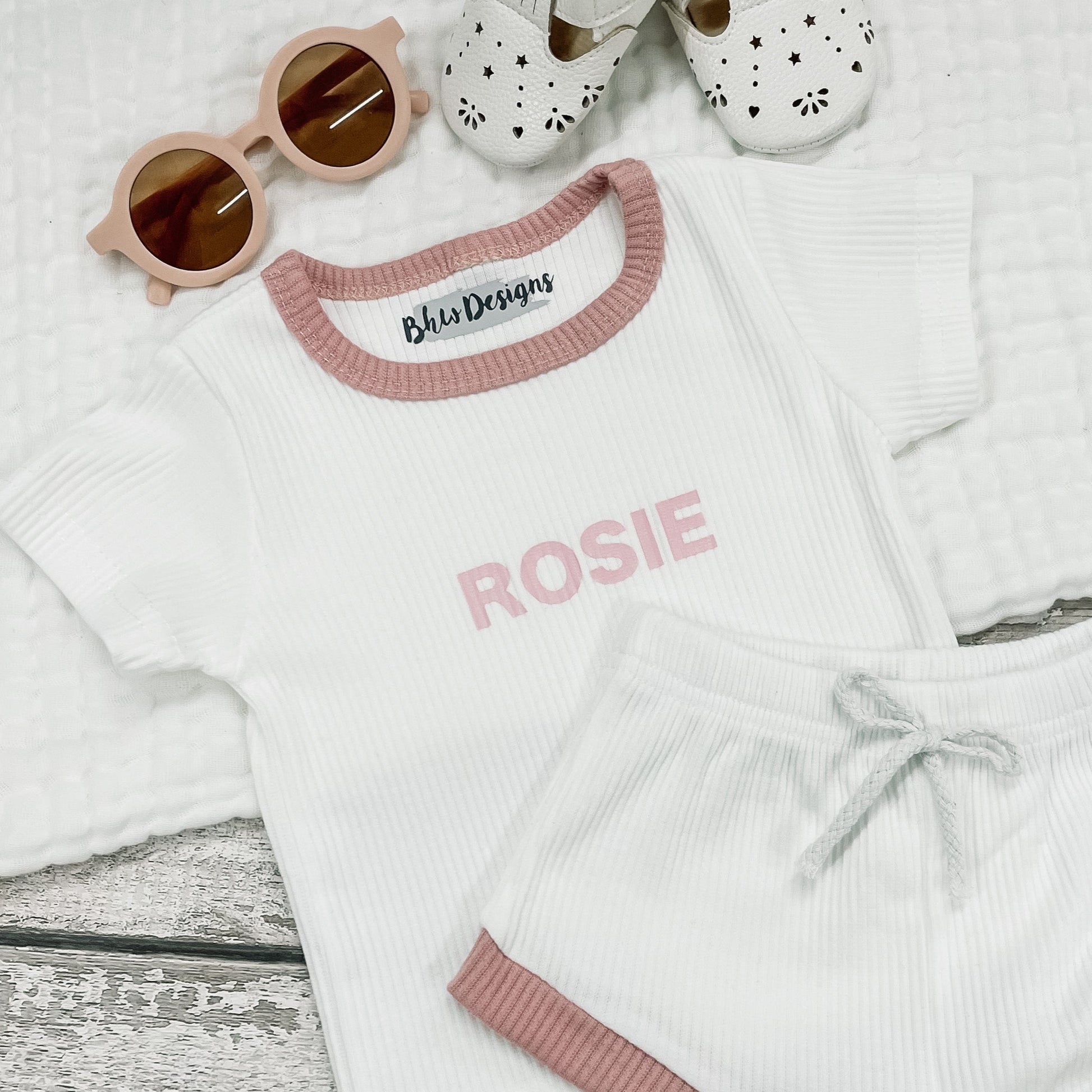 Children's white ribbed outfit with 'Rosie' on the front in baby pink 