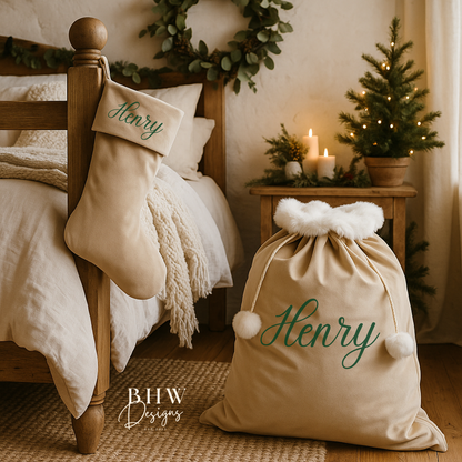 personalised Santa sack with 'Henry' with matching stocking on a bed in a cozy bedroom setting with Christmas decorations.